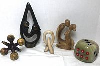 Overview of all five sculptures showing material variety and visual details