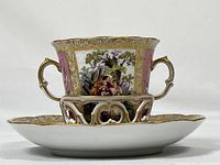 Side view showing cup inserted into the saucer’s pierced gallery, highlighting overall profile and fit.