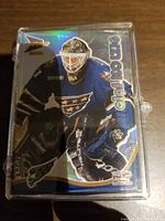 Front protective case showing a hockey goalie card from the McDonalds Pacific Prism set, featuring holographic effects and player in uniform.