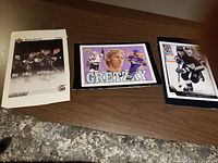 Three Upper Deck 5x7 Wayne Gretzky box topper cards from early 1990s with untrimmed borders showing Gretzky in different hockey poses and portraits.