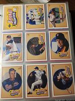 Image showing 1991 UD Baseball Heroes subset cards with multiple Nolan Ryan card fronts, mostly yellow-bordered with images of Nolan Ryan pitching or posed.