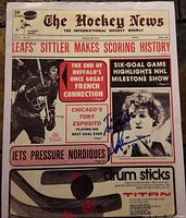 Front cover of the February 20, 1976 edition of The Hockey News showing Darryl Sittler and headlines about his six-goal game. The autograph is visible in blue ink on the bottom right section of the cover.