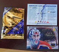 One photo showing a 3D Pinnacle Ice Breakers checklist card and a Curtis Joseph goalie card with holographic effect next to a sealed pack.