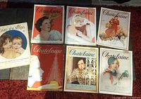 Overview of all seven magazines arranged on carpeted floor