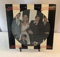 Front of Blondie Parallel Lines picture disc LP with band photo in a black and white striped sleeve.