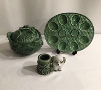 Lot overview showing all three items: green devilled egg dish, lidded cabbage bowl, and panda planter.