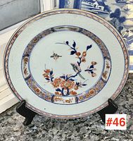 Front view of entire plate on display stand showing overall design