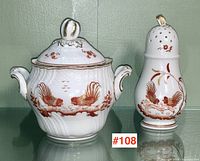 Full view of both pieces together showcasing the red bird design and gold accents