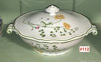 Front view of the Limoges covered server showing floral design, handles, and lid.