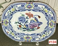 Full view of Mason's Ironstone platter showing floral and blue patterned border design.