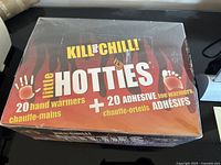 Box showing front and top view, highlighting 20 hand warmers and 20 adhesive toe warmers included.