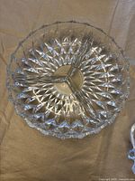 Top view of the round crystal dip divider showing the three compartments and detailed starburst pattern