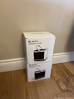 Two boxed Blaux Portable AC F832 units stacked, showing front of boxes with product image and branding.