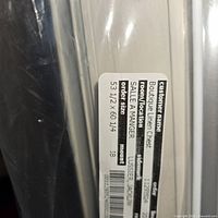 Close up image of label on a Hunter Douglas blind showing custom size 53 1/2 x 60 1/4 mounted inside and model details.