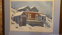 Full view of the lithograph showing the cottage in a snowy winter scene with a red and blue cabin.