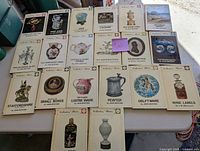 Full view of the 20 books displayed on a white surface showing titles and cover images of the collection