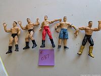 Five 7-inch wrestling action figures arranged in a row with a purple sticky note labeled #087