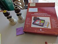 Box containing the holiday themed tray and four coasters with packaging showing festive graphics and item dimensions.