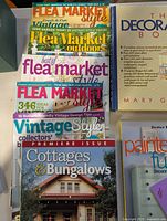 Image showing a stack of six magazines about flea market, vintage style, cottages, and bungalows, focusing on home decoration and vintage aesthetics.