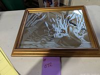 Full view of the etched glass mirror featuring a duck with cattail plants in a wooden frame.