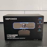Box front showing NBPOWER streaming webcam branding, model image and key features such as 1080p resolution and 60FPS.