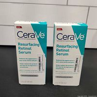 Two unopened boxes of CeraVe Resurfacing Retinol Serum, front view with product name and size visible.