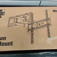 Image of the packaging box showing the TV wall mount construction and design.