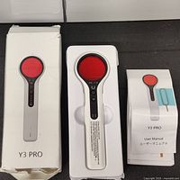Y3 PRO device in original packaging with box and user manual visible.