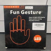 Box packaging showing branding and features of the LED colorful fun gesture sign with super bright LED display.