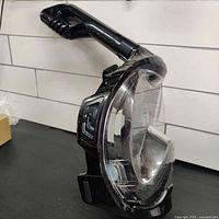 Front and side view of the Ocean LINE full face snorkel mask showing clear viewing panel and snorkel tube.