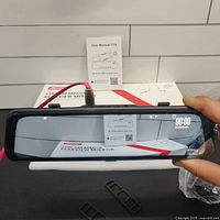 Front view of Jansite T79 rear view mirror dash cam powered on, showing 4K display interface with date/time and icons.