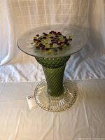 Overall view of the glass birdbath/plant stand with colored glass beads on top, showing height and structure