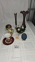 Full lot of demitasse cup and saucer, miniature metal teapot, trinket box, miniature frame, botanica flowers, metal vase, scalloped-edge vase