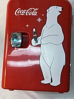Red Coca Cola mini car cooler front with polar bear holding a Coke bottle and latch