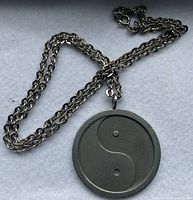 Photo of full necklace with Ying Yang pendant, showing chain and pendant details.