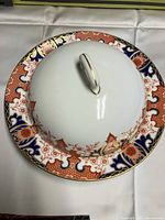 Covered dish with lid, showing top and detailed pattern