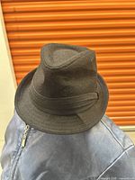 Black Nathaniel Cole fedora hat on a mannequin head, showing the front and top.