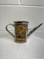 Front view of the vintage Olio San Remo D’Oliva tin can with spout and handle, showing label artwork and branding on the side.