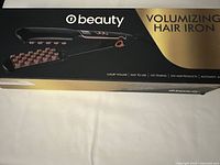 Photo of the Beauty volumizing hair iron box showing the product image and branding on the front.