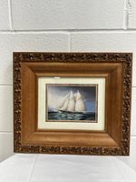 Full frontal photo of the framed sailing ship wall print showing the entire artwork and frame.