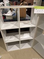 6-cube white shelving unit showing 2x3 cube compartments and overall condition