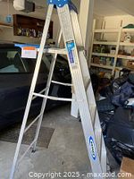Photo showing the full view of the Werner 6 foot aluminum ladder in a garage setting.