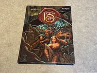 Front cover of the 13th Age Role Playing Game Core Book hardcover edition showing fantasy adventurers.