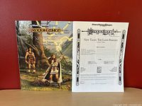 Photo showing inside contents page of Dragonlance New Tales: The Land Reborn game adventure including table of contents and TSR copyright.