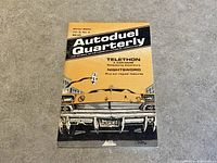 Front cover of Autoduel Quarterly Vol. 2 No. 4 Winter 2034 magazine showing a yellow and black themed illustration of a car front view with license plate 'MOVE'.