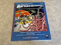 Front cover showing colorful illustrated space adventure scene with spaceship crew and tentacled alien