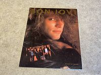 Front cover of the book showing a close-up of a Bon Jovi member and a smaller photo of the band.
