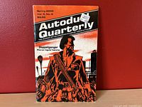 Front cover of Autoduel Quarterly Vol. 3 No. 2 Spring 2035 showing title, issue details, and cover art of illustrated man with bandolier and urban background.