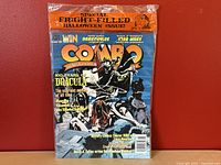 Front cover of Combo magazine issue #34 with Halloween special and Dracula-themed artwork, sealed in original plastic.