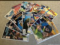 Array of 14 Advanced Dungeons & Dragons comic books numbered #1 to #14, arranged fan-like, all bagged and boarded.